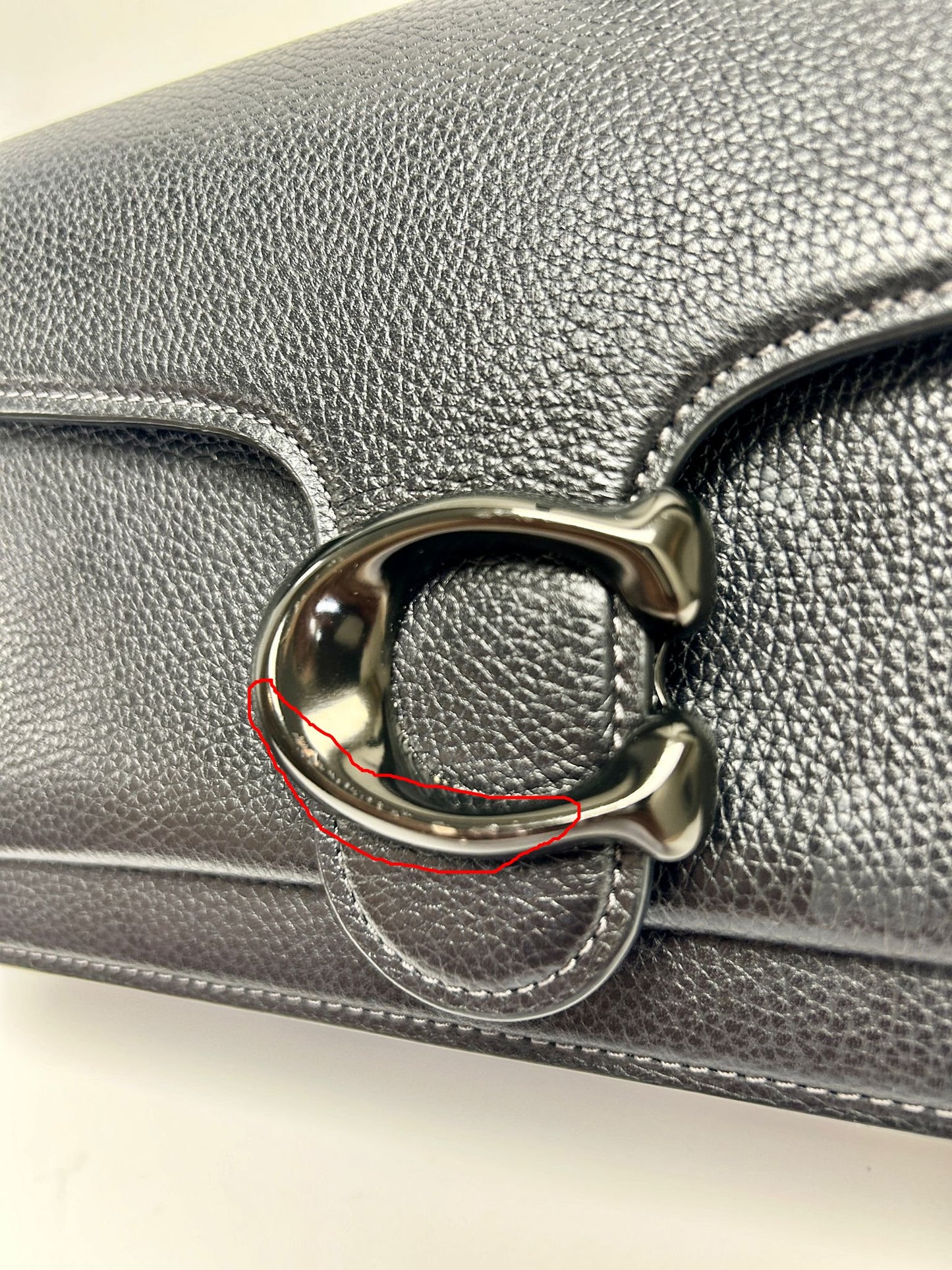 Factory defect bag, the "C" clasp has a slight paint flaw that is imperceptible