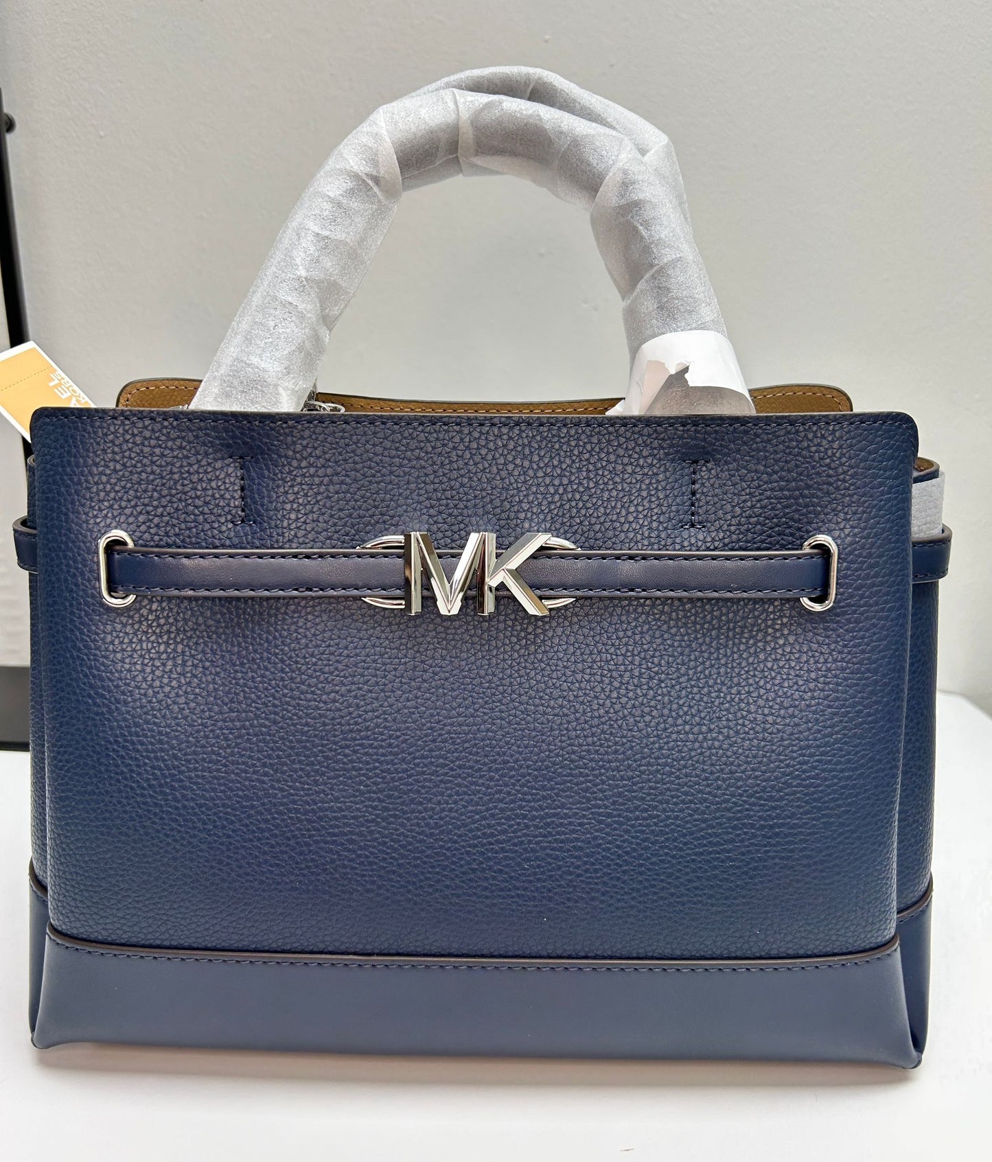 MK Reed Satchel Bag with MK logo and strap