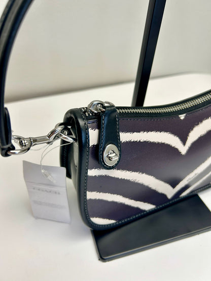 Bolso Coach Swinger 20 con estampado de cebra