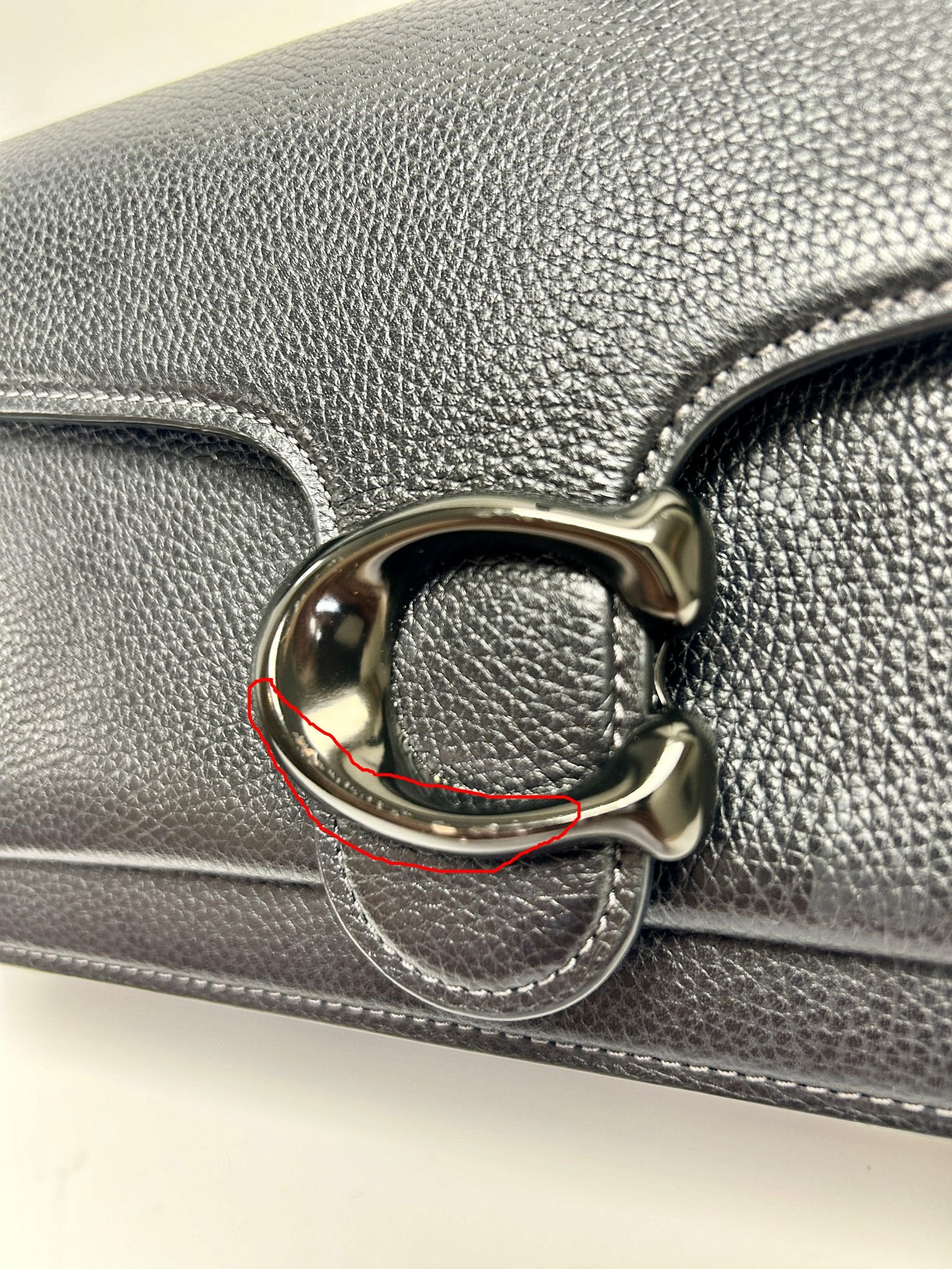 Factory defect bag, the "C" clasp has a slight paint flaw that is imperceptible